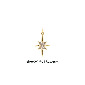 May include: Gold-tone star charm with clear cubic zirconia stones. The charm measures 29.5 mm by 16 mm by 4 mm.
