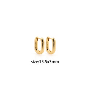 May include: A pair of gold-toned hoop earrings with a rectangular shape. The earrings are 15.5 mm by 3 mm in size.