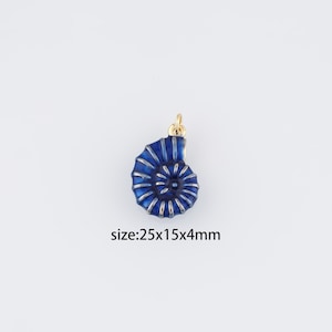 May include: A blue and gold enamel seashell charm pendant, measuring 25x15x4mm.