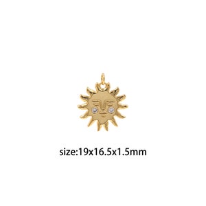 May include: Gold-toned sun charm with a face and two small clear rhinestones for eyes. The charm is 19mm x 16.5mm x 1.5mm.