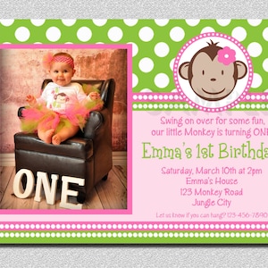 May include: A pink and green polka dot birthday invitation with a photo of a baby girl sitting in a chair. The invitation says "Emma's 1st Birthday!" and includes the date, time, and location of the party. The invitation also features a cartoon monkey with a pink flower.