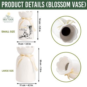 May include: White ceramic blossom vases, small size 5.5 inches tall and 3.5 inches wide, large size 7.8 inches tall and 4.3 inches wide. The small vase has a Winnie the Pooh illustration and text. Both vases have a scalloped top and ribbon detail.