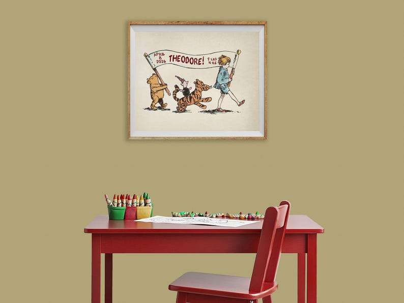May include: A framed illustration featuring Winnie the Pooh, Tigger, and Christopher Robin. The banner reads "THEODORE!" with the date "APRIL 8 2024" and the weight "7 lbs 4 oz". The artwork is displayed above a red table with art supplies.