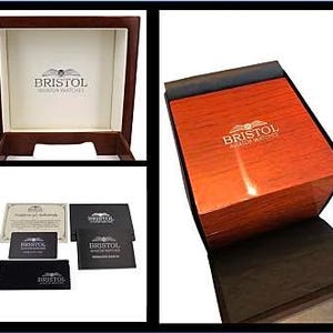 May include: A wooden watch box with a glossy, reddish-brown finish. The box is open, revealing a cream-colored interior with the "BRISTOL AVIATOR WATCHES" logo. Additional items include a certificate, cards, and a black cloth.