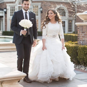 Stunning Modest Wedding Dress with Long Sleeves French Lace and Wave Organza by Award Winning Bridal Salon in Teaneck, NJ image 3