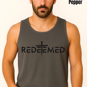 Searching for a meaningful yet stylish gift? Our Comfort Colors tank featuring the bold “Redeemed” design is the perfect choice. This faith-inspired shirt isn’t just another tee—it’s a powerful expression of Christian beliefs and personal testimony. Whether you're shopping for a thoughtful birthday gift, encouragement for a loved one, or simply want to bless someone with a message of redemption, this shirt makes a lasting impression.