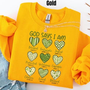 This sweatshirt is more than cute—it’s a declaration of faith 💚 The Gildan crewneck fit is soft, cozy, and easy to style, whether you’re heading to church, running errands, or enjoying a relaxed St. Patrick’s Day celebration. Each word reminds you of God’s truth about who you are—something worth carrying with you every day. If you love Christian gifts that are meaningful, wearable, and uplifting, this one belongs in your closet.