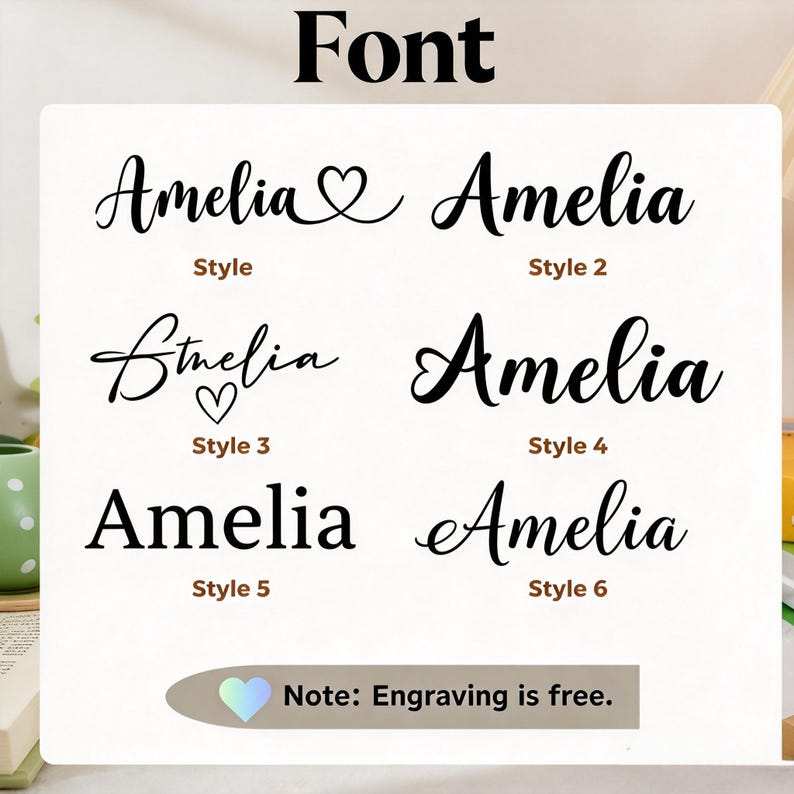 Może przedstawiać: Tabela wyboru czcionek przedstawiająca imię Amelia w sześciu r&oacute;żnych czarnych stylach typograficznych. Każdy styl jest oznaczony od Style 1 do Style 6. Tabela zawiera nagł&oacute;wek Font oraz notatkę na dole: Note: Engraving is free.