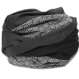 May include: Black and white patterned fabric headband with a black solid fabric layer.