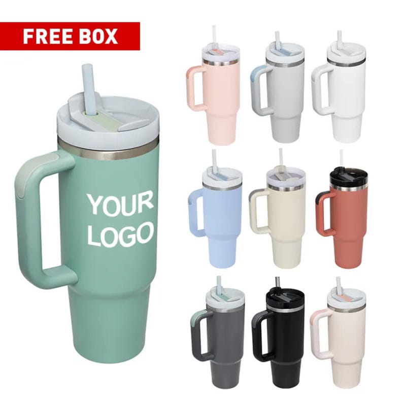 May include: A collection of insulated tumblers with handles and straws in various colors, including teal, pink, gray, white, blue, beige, and black. The teal tumbler has the text "YOUR LOGO" printed on it. The tumblers are designed to keep drinks cold.