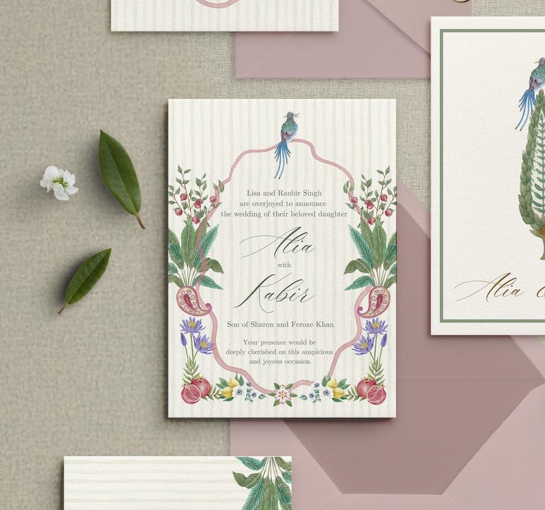 May include: Wedding invitation with floral and paisley design. The invitation features the names "Alia" and "Kabir" in elegant script, surrounded by botanical illustrations and a bird. The text reads "Lisa and Ranbir Singh are overjoyed to announce the wedding of their beloved daughter."