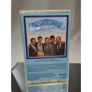 May include: A vintage cassette tape for "The Cathedrals" album, "Something Special." The cover features a group photo of the band in suits and ties. The tape is in a clear plastic case with blue and white text.
