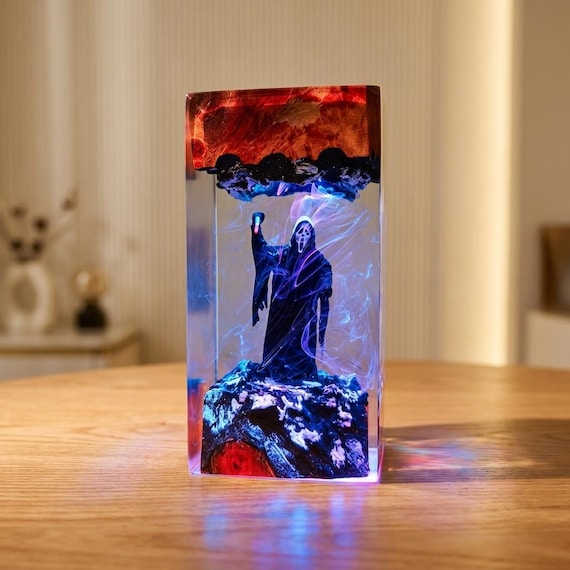 A gothic horror epoxy resin LED lamp handcrafted in wood — spooky atmospheric desk art that earns its keep year-round, not just at Halloween.