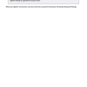 May include: White page with text about tubing with dents and their potential to cause overheating. The text also includes instructions on tightening fittings and using wrenches to prevent bending or breaking tubing.