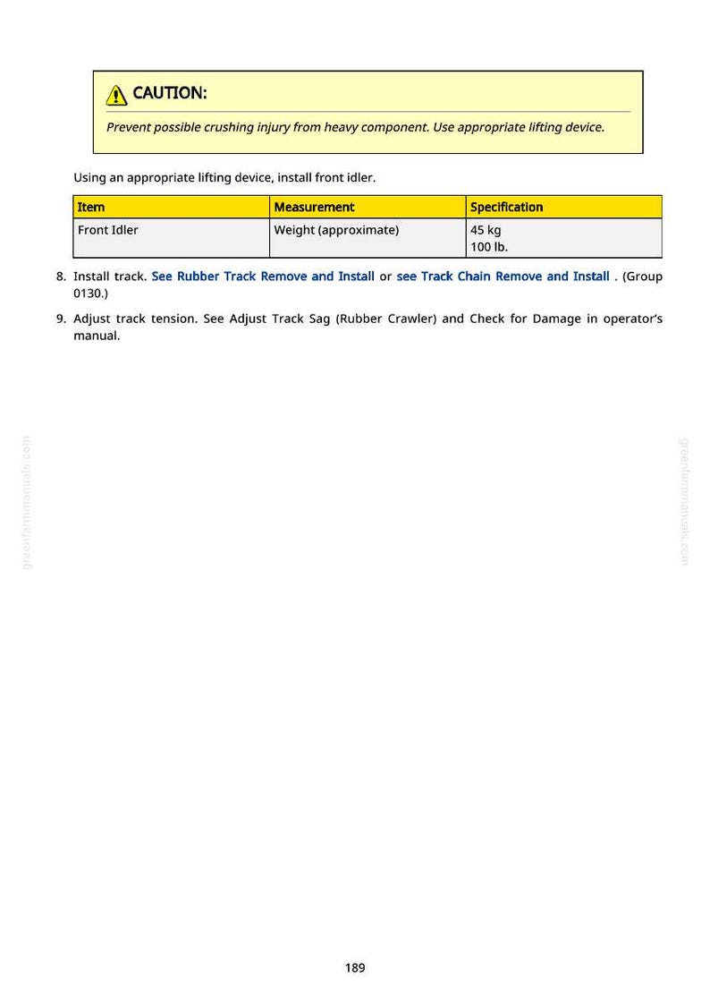 May include: A manual page with a yellow caution box at the top. The text warns of crushing injuries and instructs the user to use a lifting device. A table lists the front idler weight as approximately 45 kg.
