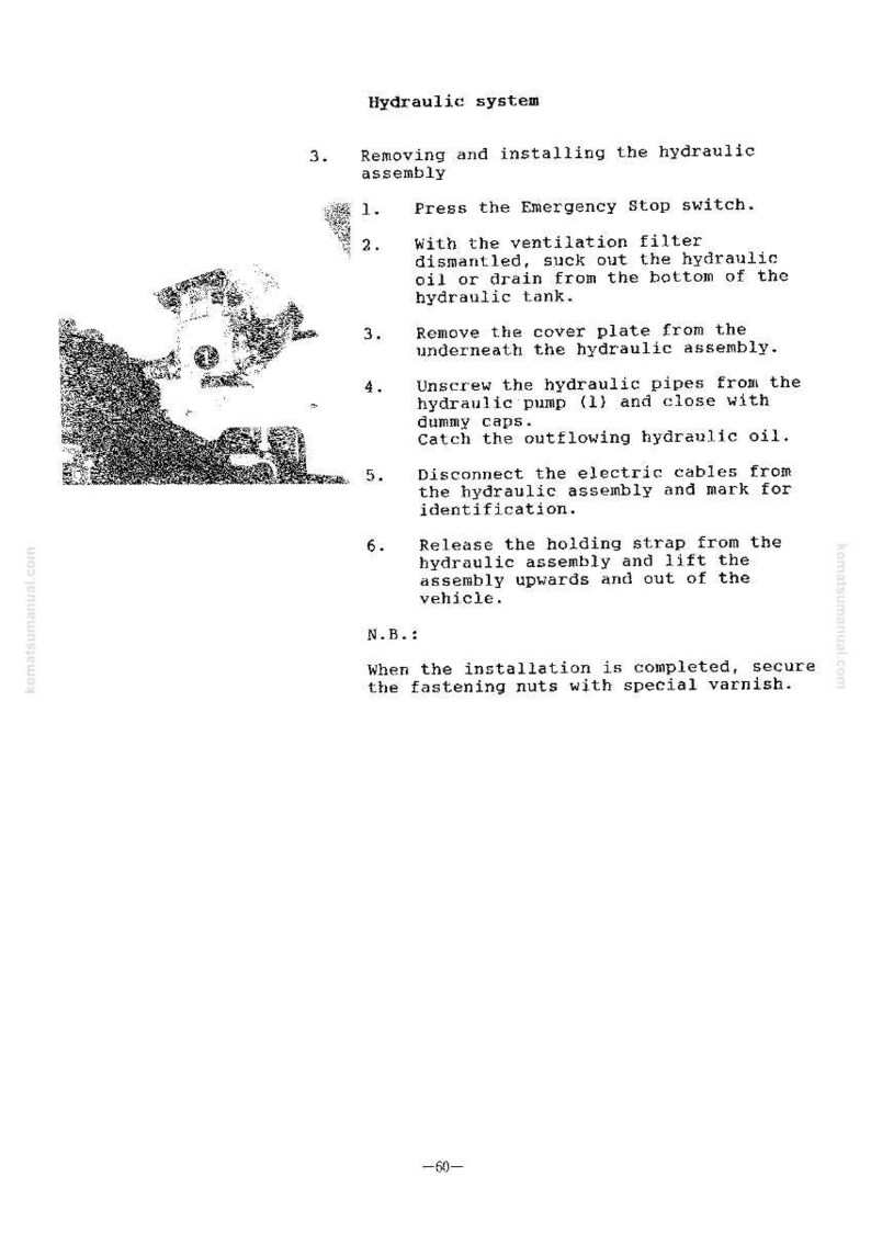 May include: A page from a manual detailing the hydraulic system, with instructions for removing and installing the hydraulic assembly. The text includes steps like pressing the emergency stop switch and disconnecting cables. The page is in black and white.