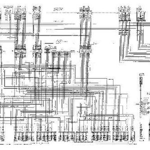 May include: A detailed black and white schematic diagram, likely an electrical or mechanical blueprint. The diagram features numerous lines, symbols, and labels, creating a complex and technical visual representation.