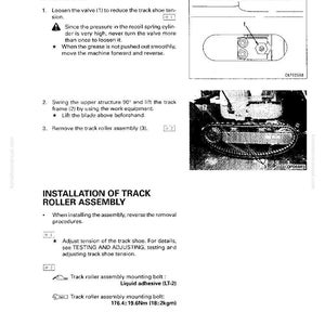 May include: A technical manual page illustrating the removal and installation of a track roller assembly. The diagram shows the track roller assembly and its components, with text instructions and diagrams for disassembly and assembly.