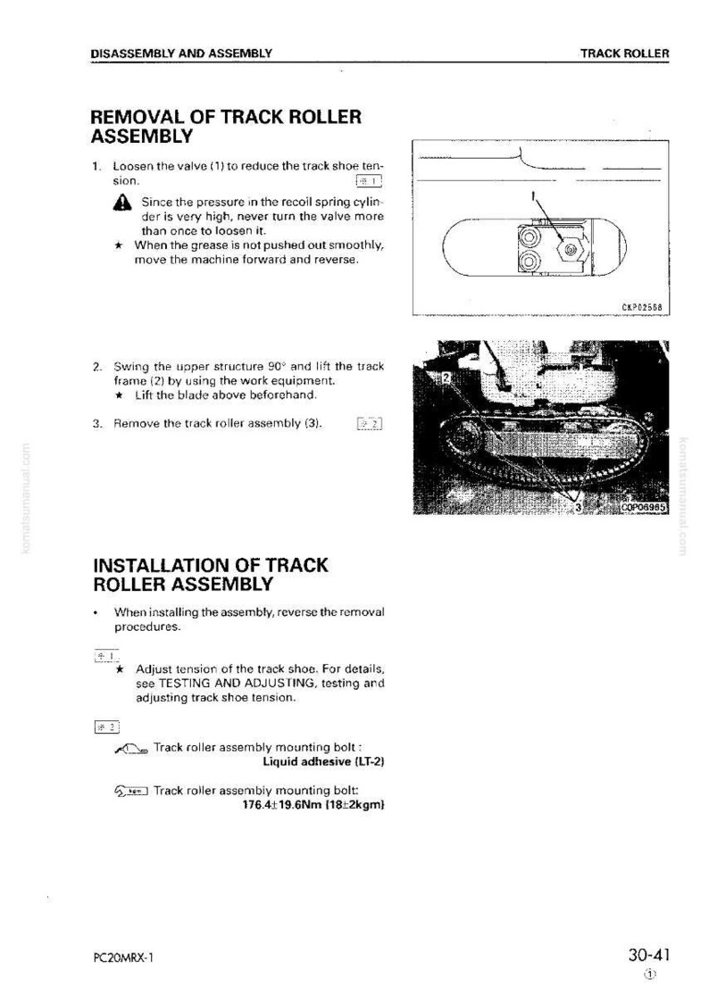 May include: A technical manual page illustrating the removal and installation of a track roller assembly. The diagram shows the track roller assembly and its components, with text instructions and diagrams for disassembly and assembly.