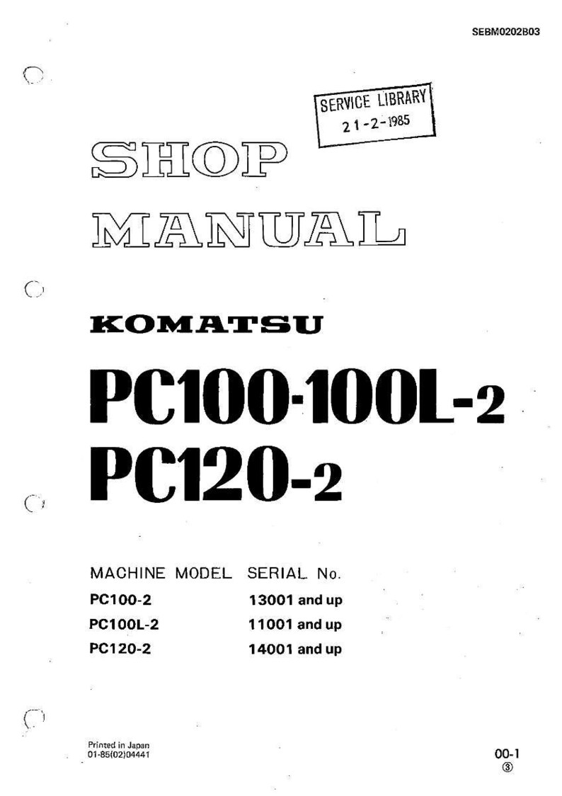May include: A white Komatsu shop manual with the text "SHOP MANUAL" and "PC100-100L-2 PC120-2". Includes a "SERVICE LIBRARY" stamp dated 21-2-1985. The manual lists machine models and serial numbers.