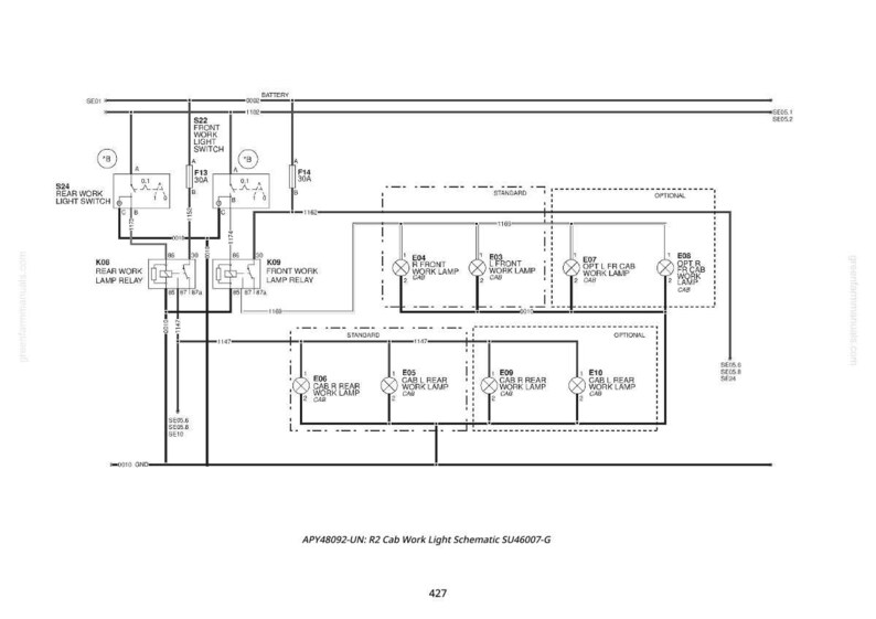 Pu&ograve; includere: Un diagramma schematico in bianco e nero del sistema di illuminazione di lavoro della cabina di un veicolo. Il diagramma include etichette per vari componenti come rel&egrave;, interruttori e lampade, con linee che indicano i collegamenti elettrici. Il testo in basso recita "APY48092-UN: R2 Cab Work Light Schematic SU46007-G".