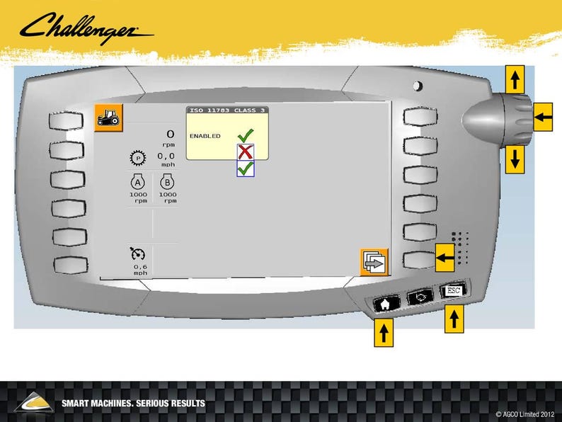 May include: A gray Challenger machine control panel with a screen displaying operational data. The panel has multiple buttons, a rotary dial, and icons for various functions. Text includes "ENABLED", "0.0 mph", and "1000 rpm".