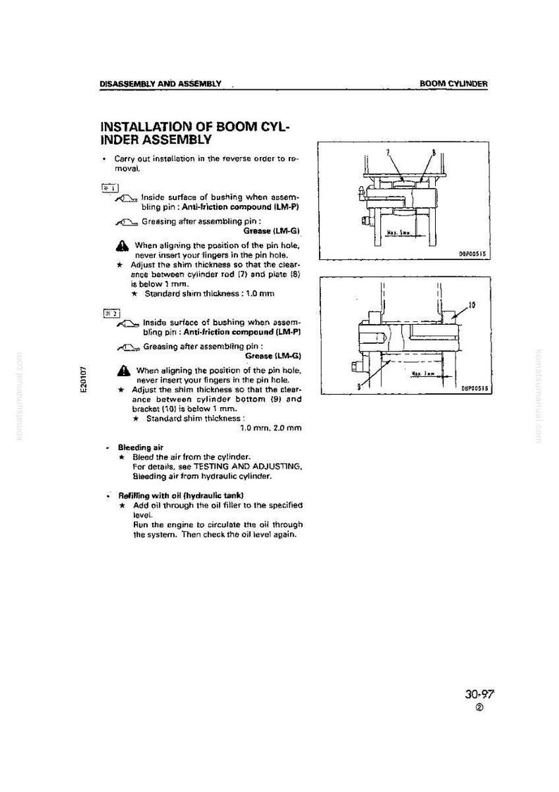 May include: A technical diagram from a manual detailing the installation of a boom cylinder assembly. The page includes diagrams, instructions, and specifications for the assembly process, including measurements in millimeters.