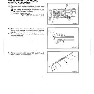 May include: A technical diagram detailing the disassembly of a recoil spring assembly. The diagram includes illustrations and instructions for removing components, including a spring, lock plate, and nut. Text includes "Approx. 500 kN (approx. 51 ton)".