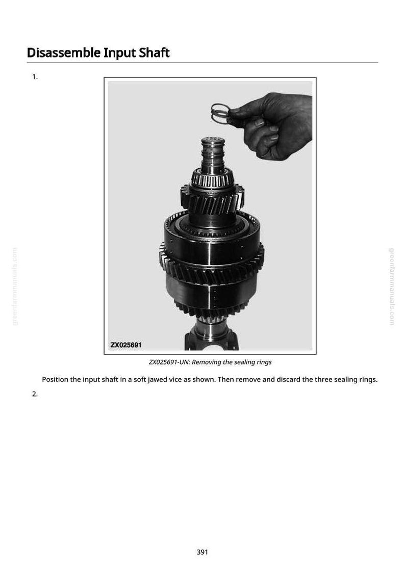 May include: Black and white image of a mechanical component being disassembled. The text "Disassemble Input Shaft" is at the top. A hand is holding a sealing ring above the component. The text "ZX025691-UN: Removing the sealing rings" is also present.