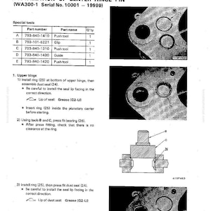 May include: Technical diagram for the installation of a center hinge pin, including part numbers and assembly instructions. The diagram features detailed illustrations and text, with labels for various components and tools.