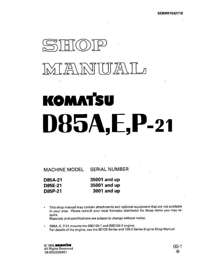 May include: A white shop manual with the title "SHOP MANUAL" in large, outlined text. Below, the text "KOMATSU D85A,E,P-21" is prominently displayed. The manual includes machine model and serial number information.