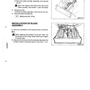 May include: A technical diagram with instructions for removing and installing a blade assembly. The text includes steps for removing pins, retracting rods, and adjusting shims. The blade assembly weighs 42 kg.