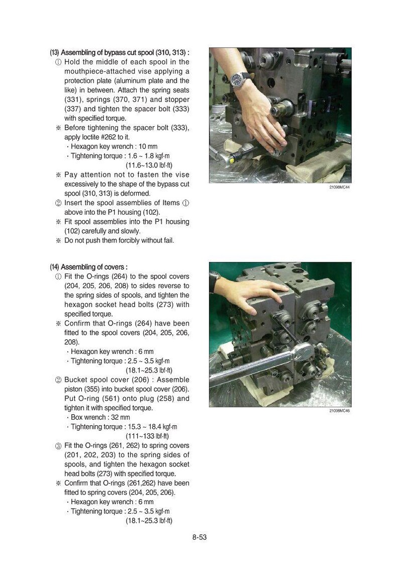 May include: An industrial machine component is being assembled with a wrench. The image shows a close-up of the process, with hands using a wrench to tighten a bolt on a metal component. The component has multiple parts.