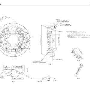 May include: Detailed technical drawing of a wheel brake assembly, labeled "WHEEL BRAKE" with model numbers. The diagram includes multiple views and dimensions, with text annotations and a schematic layout.