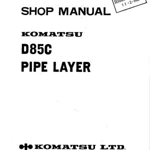 May include: A white shop manual cover with black text. The title reads "SHOP MANUAL" above "KOMATSU D85C PIPE LAYER." A stamp indicates "SERVICE DEPARTMENT 11-2-1983." The Komatsu Ltd. logo is at the bottom.