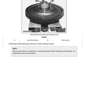 May include: An instructional diagram shows the assembly of a freewheel unit. The image includes a gear, taper roller bearing, and retaining ring. Text on the image reads "KM1001485-UN: Assemble the Freewheel Unit."