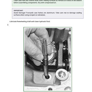 May include: An image from a manual showing a freewheeling shaft assembly. The image includes a close-up of a hand holding a tool inserting it into a mechanical component. Text in the image provides instructions and warnings for the assembly process.