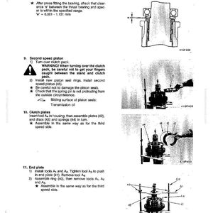 May include: A technical diagram from a manual detailing the disassembly and assembly of second and third-speed clutch packs. The image includes diagrams, measurements, and instructions for mechanical components. Text includes warnings and part numbers.