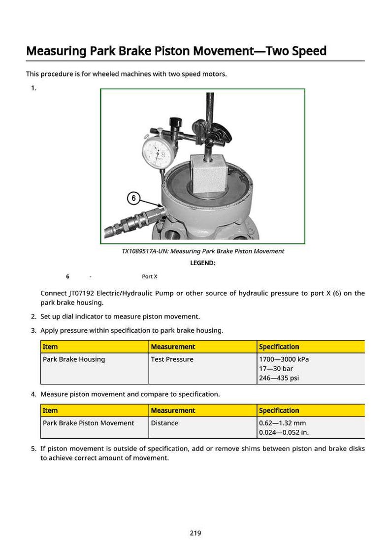 May include: Diagram showing park brake piston movement measurement. A dial indicator measures piston movement on a wheeled machine. Specifications include test pressure and distance measurements in mm and inches.