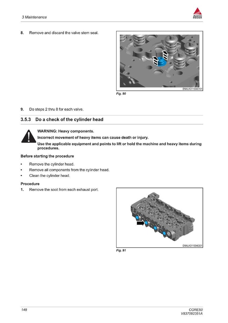 May include: Image from a maintenance manual showing a cylinder head with blue and black components. The diagram includes text instructions and warnings about heavy components and procedures.