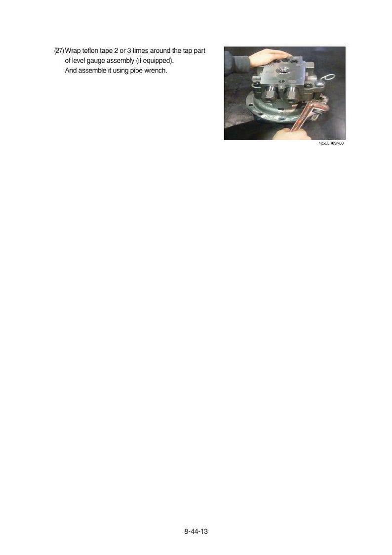May include: Image shows the assembly of a level gauge. A pipe wrench is used to assemble the parts. The text in the image says to wrap teflon tape around the tap part of the level gauge assembly.