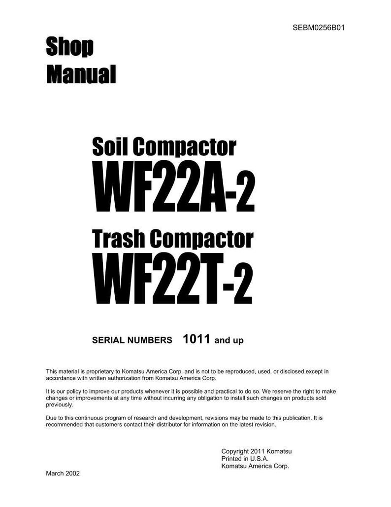 May include: A white shop manual with black text. The title reads "Shop Manual." It lists "Soil Compactor WF22A-2" and "Trash Compactor WF22T-2." The serial numbers are 1011 and up. Copyright 2011 Komatsu America Corp.