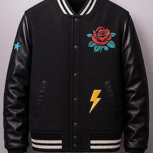 May include: Black varsity jacket with leather sleeves. Features a red rose and lightning bolt embroidery. Includes a blue star on the left sleeve and white striped details on the collar, cuffs, and hem.