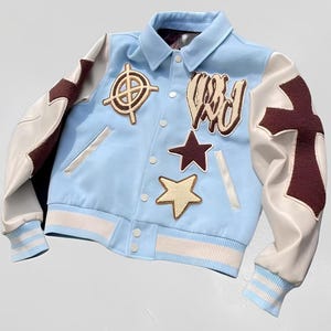 Trendy "Mazinbody Skeleton Varsity Jacket – 'In This Life' Edition (Sky Blue/Bone White)" Jacket
