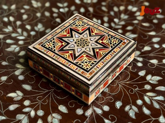 Syrian mosaic inlay work on a small jewelry box — a genuine craft tradition that makes this a conversation piece, not just a trinket dish.
