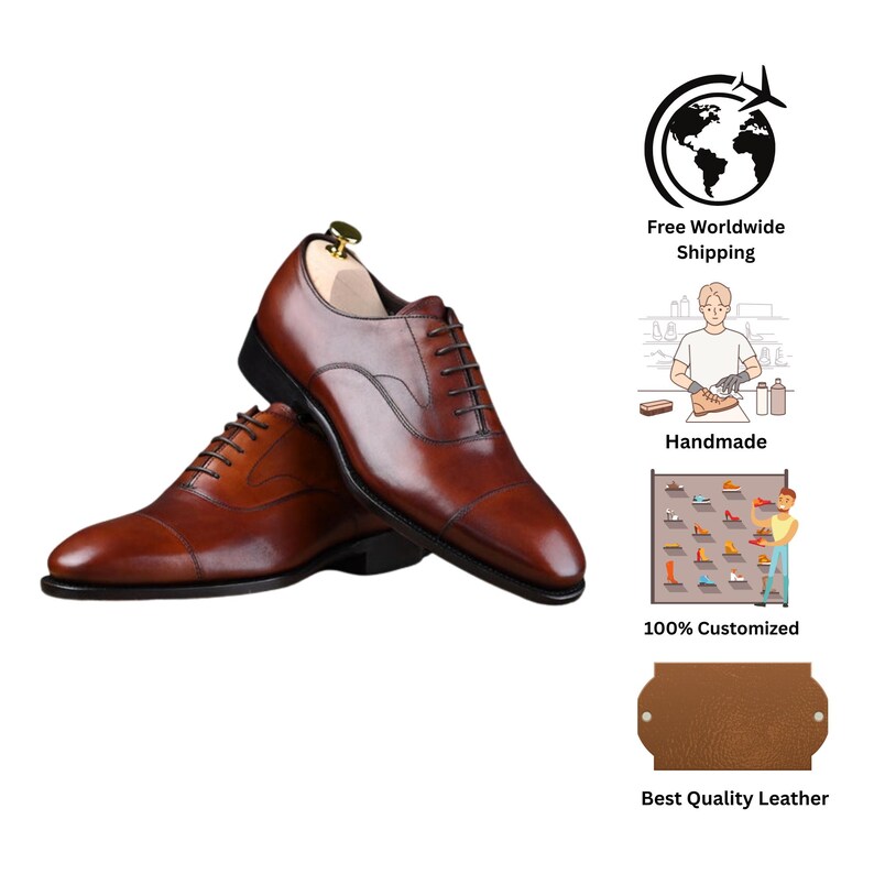 May include: A pair of brown leather oxford shoes with a cap toe design, dark brown laces, and a polished finish. The shoes feature a sleek silhouette with a low heel and a dark sole, presented with a wooden shoe tree inserted in the right shoe.