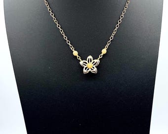 Cream and Gold Dimemsionsl Pendant on a Gold Chain
