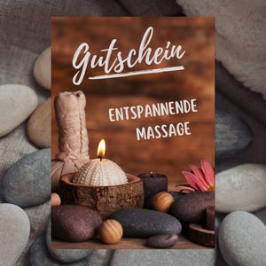 May include: A spa-themed image with a lit candle in a wooden holder, massage stones, and a gift certificate. The certificate reads "Gutschein ENTSPANNENDE MASSAGE" in white script. A pink flower and a massage ball are also visible.