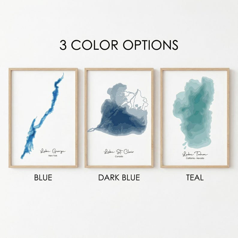 May include: Three framed prints displaying lake topography in blue, dark blue, and teal. Each print features a different lake: Lake George, Lake St. Clair, and Lake Tahoe. The text "3 COLOR OPTIONS" is at the top, with colour names below.