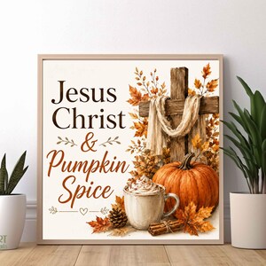 May include: A square framed wall art print featuring the text Jesus Christ & Pumpkin Spice in brown lettering. The design includes a wooden cross draped with fabric, an orange pumpkin, a mug of coffee with whipped cream, and autumn leaves.